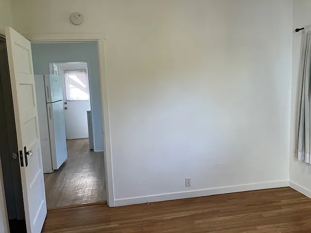 Back bedroom looking toward kitchen & laundry area