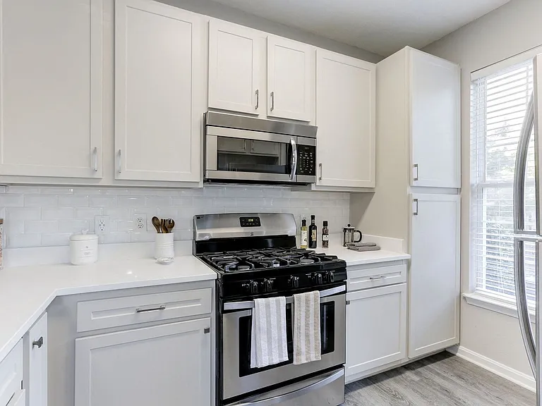 Gourmet kitchens feature stainless steel appliances.