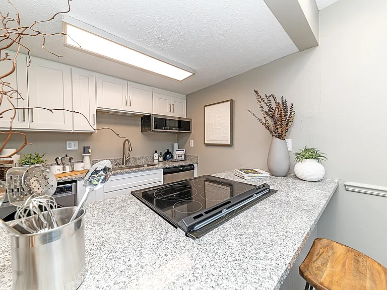 Kitchen with granite counters and stainless appliances