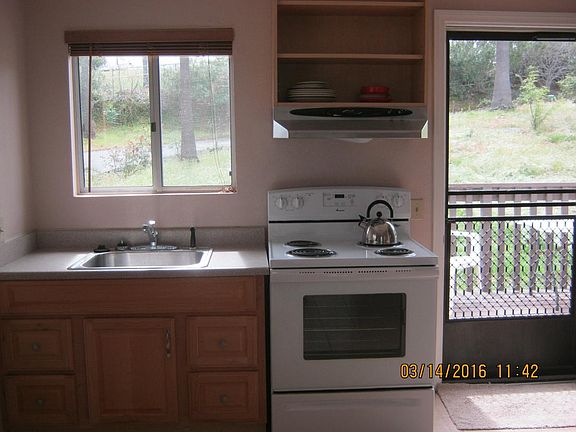 Kitchen with deck & backyard view.