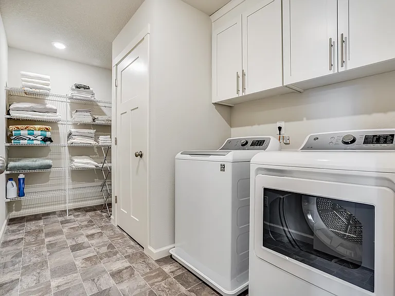 Lots of storage, space and full size washer / dryer in the living room