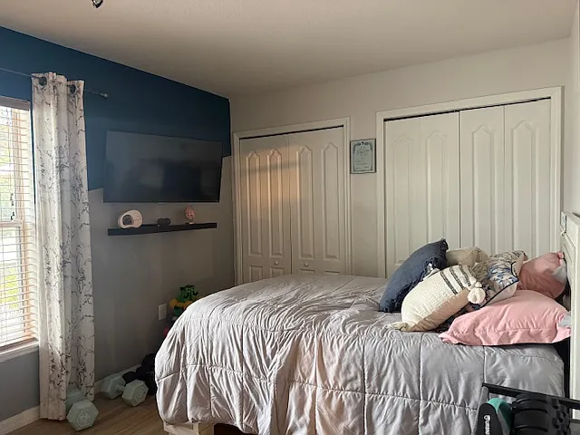 Cozy and well-lit bedroom with ample closet space