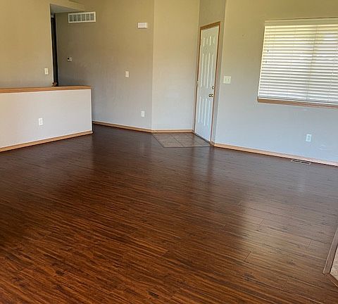 Front door and spacious living room