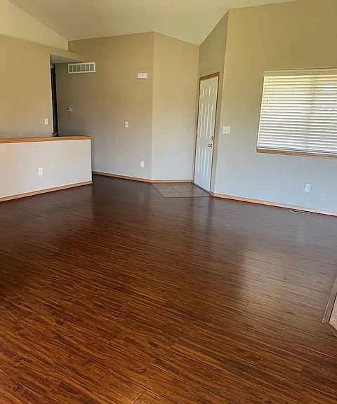 Front door and spacious living room