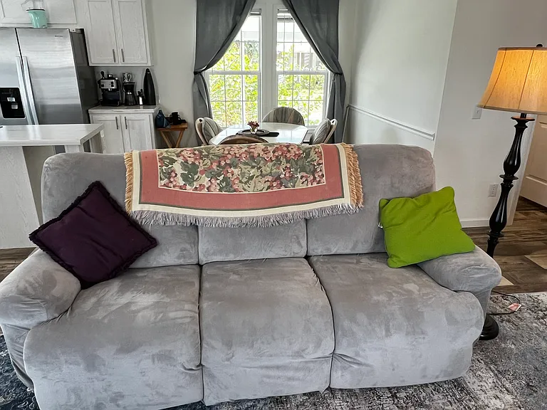 One of two matching couches with end recliners. Looking towards private covered lanai.