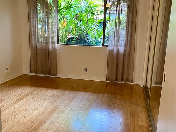 Bedroom one with large mirrored closet