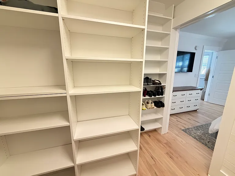 large walk in closet with built in storage