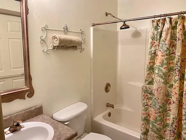 2'nd Bedroom bath or guest bathroom. Enter from either hallway or 2'nd Bedroom. Includes full shower/soaking tube. Hardware accented in popular rose-gold!