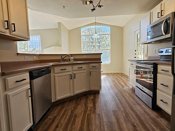 Stainless steel appliances, freshly painted cabinets, plenty of storage