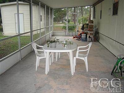 Huge lanai almost the length of the home. Newer shed in back with power, windows and high ceiling.