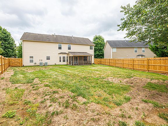 Large fully-fenced, level backyard