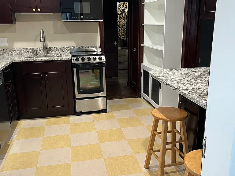Kitchen includes plenty of counters, cupboards, and seating