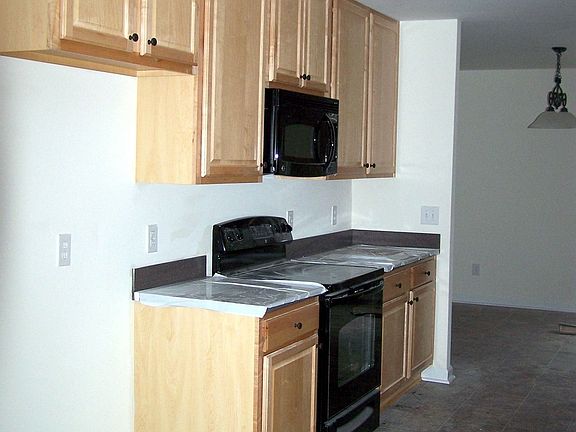 42"H natural maple cabinets w/solid surface ctrtps