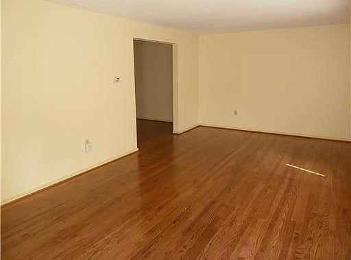 This living room has tons of space and open to the formal dining room.