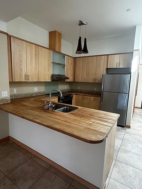 View from Kitchen, great lighting, new appliances, and new ceiling fan with LED light