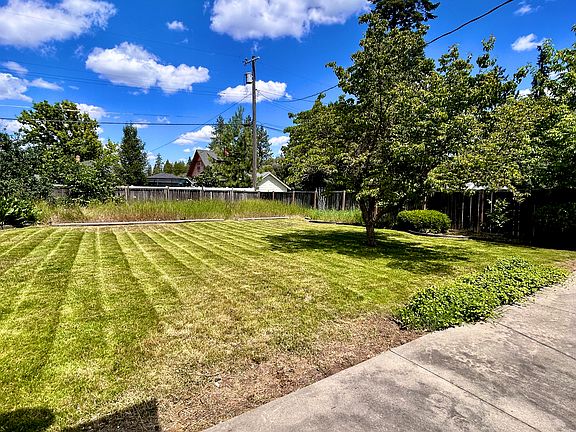 Back yard with large patio July 2026