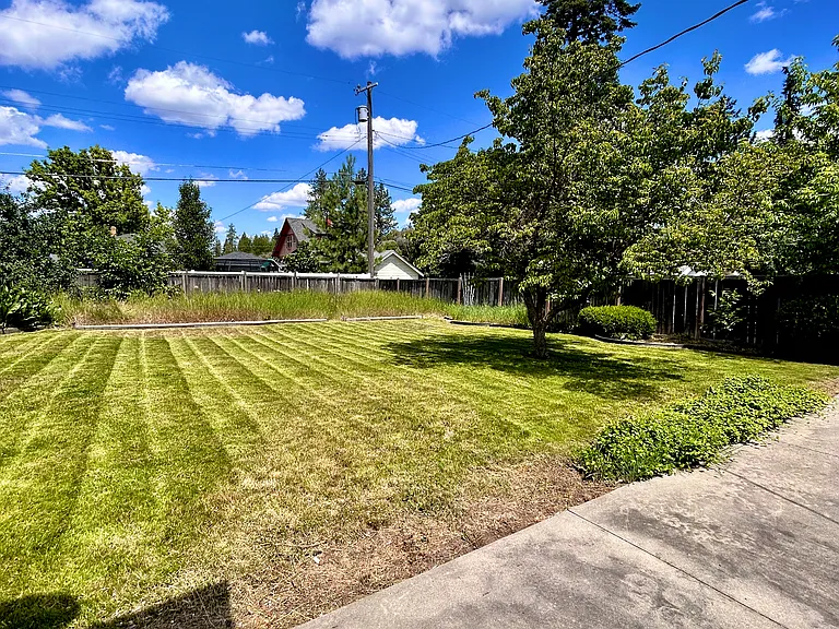 Back yard with large patio July 2026