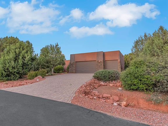 Front of the house with driveway.
