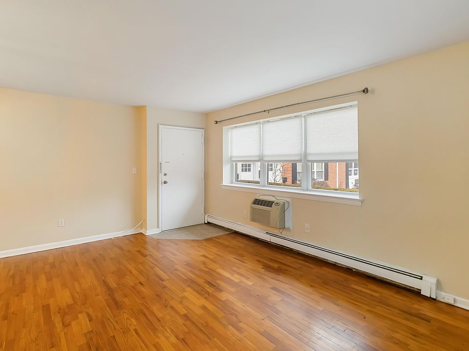 Living Room with Wall Air Conditioner.
Hardwood Floors.