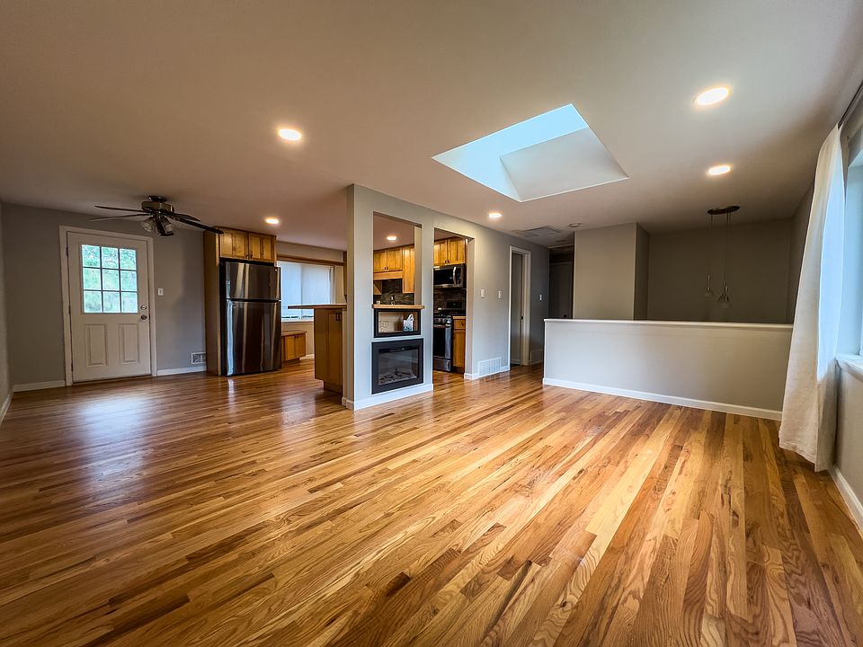 Open living/kitchen/dining area with tons of natural light