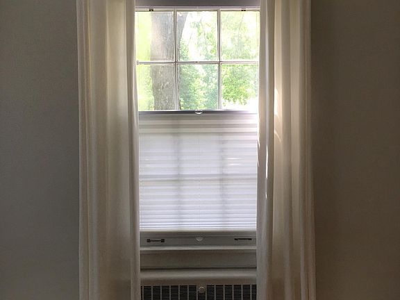 Shades in living and dining rooms come down from the top (an