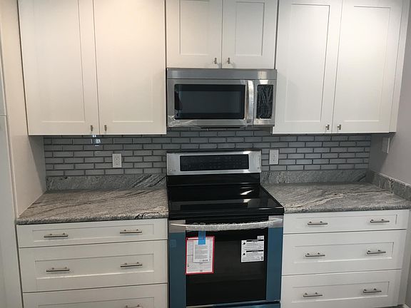 Kitchen - Glass Top Stove / Oven / Microwave and Glass Tile Back-splash