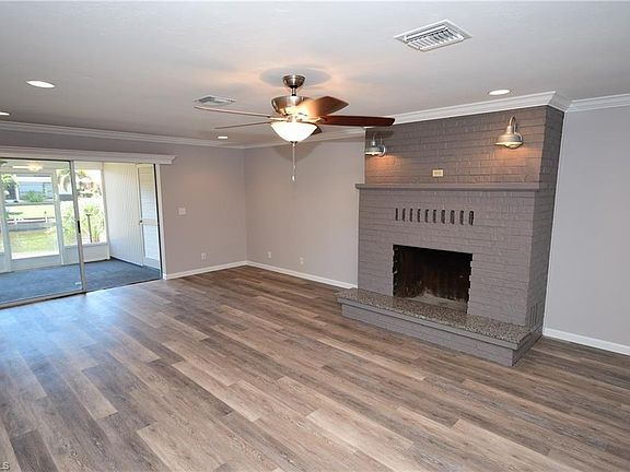 Walk right into a huge living area that includes a fireplace. (No fire in fireplace due to safety.)