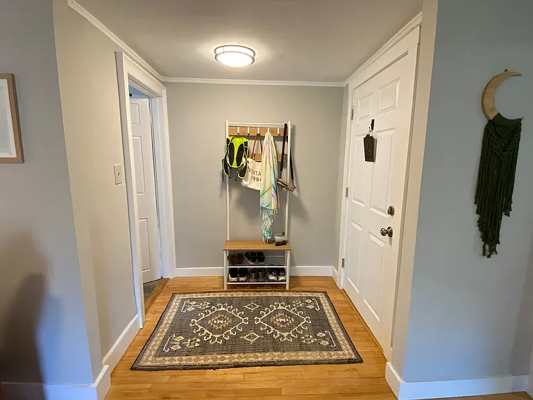 Main entry foyer. Door to bathroom on left.