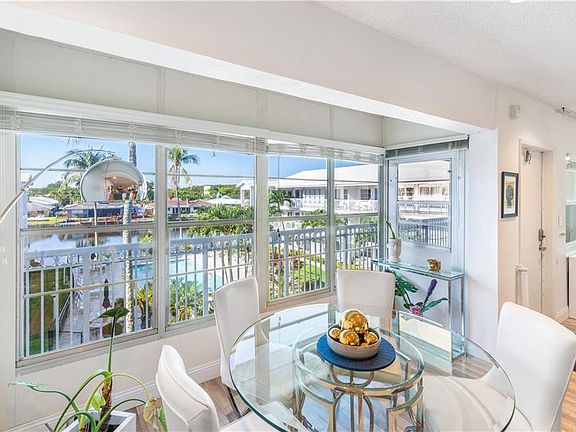 Direct view to New River and pool with metalic glazed windows for privacy - limited sight into unit