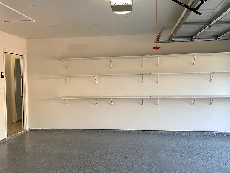 Garage with Epoxy Floor and Shelves for Extra Storage