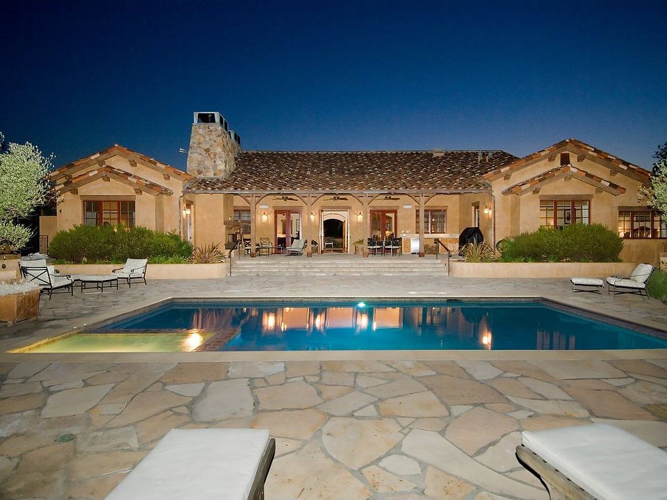 Exterior view of the back terrace and pool/spa.