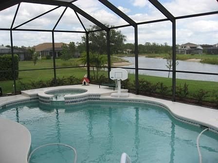 Oversized pool and spa with long lake views