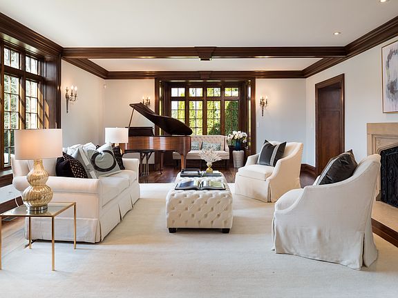 Beautiful and Bright Living Room With Stone Gas Fireplace, Beamed Ceiling, Gorgeous Carlyle Wide Planked Furniture Grade Wood Floors Throughout, Doors To Patio