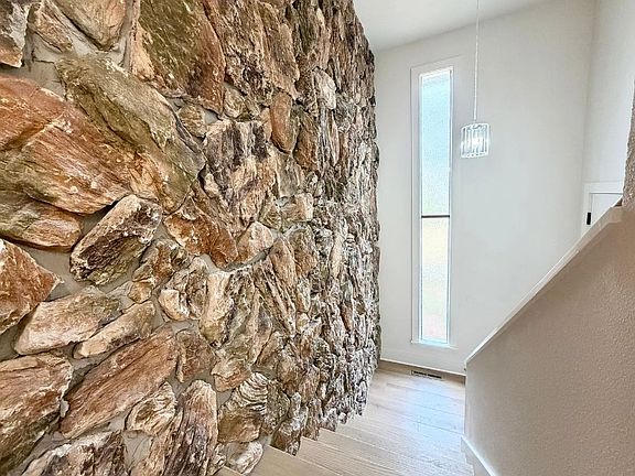Looking down at stair landing from living area.