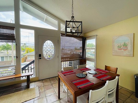 The dining area with dimmable chandalier.
