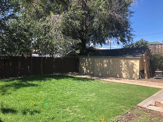 Backyard with Patio/BBQ area and outdoor storage unit