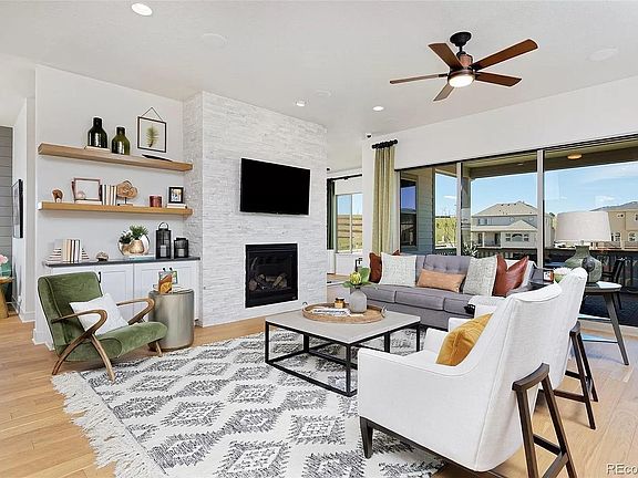 Great room with stone fireplace and built-in cabinets
