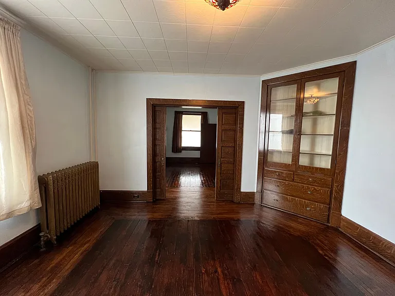 living room pocket doors and built in cabinet