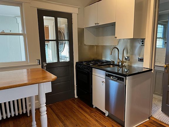 Kitchen includes granite counters, breakfast island, dishwasher, garbage disposal, ice maker.