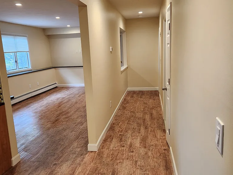Hallway leading into kitchen and living room