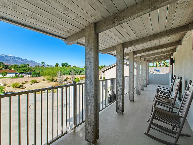 OUTDOOR COVERED DECK WITH EXPANSIVE VIEWS