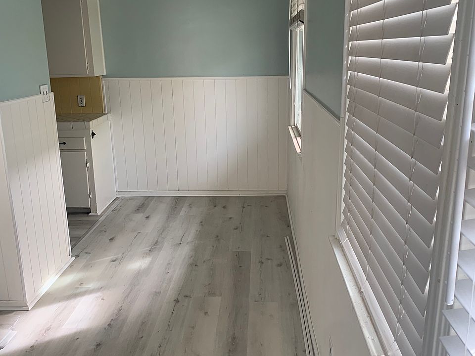 Open dining room off kitchen, at end of living room.
