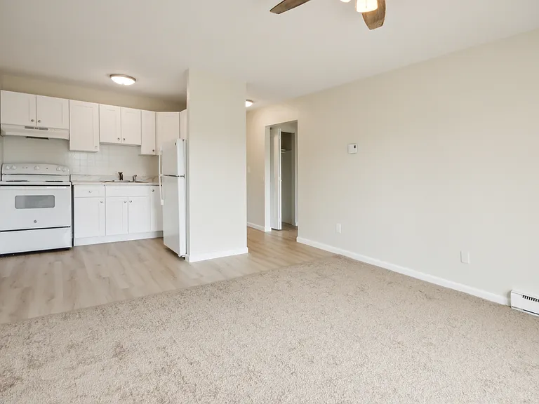 Studio Kitchen with range and refrigerator.