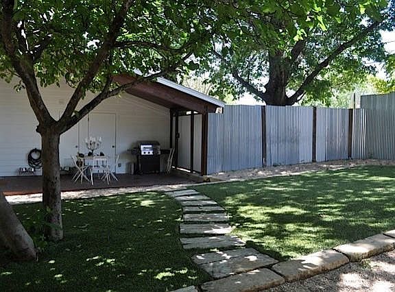 back yard with 8 ft privacy fence