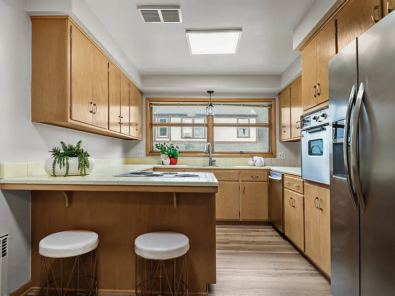 The countertops have just been replaced with a butcher block countertop (right after photos taken) and new blue backsplash is currently being installed. New photos for the kitchen coming.