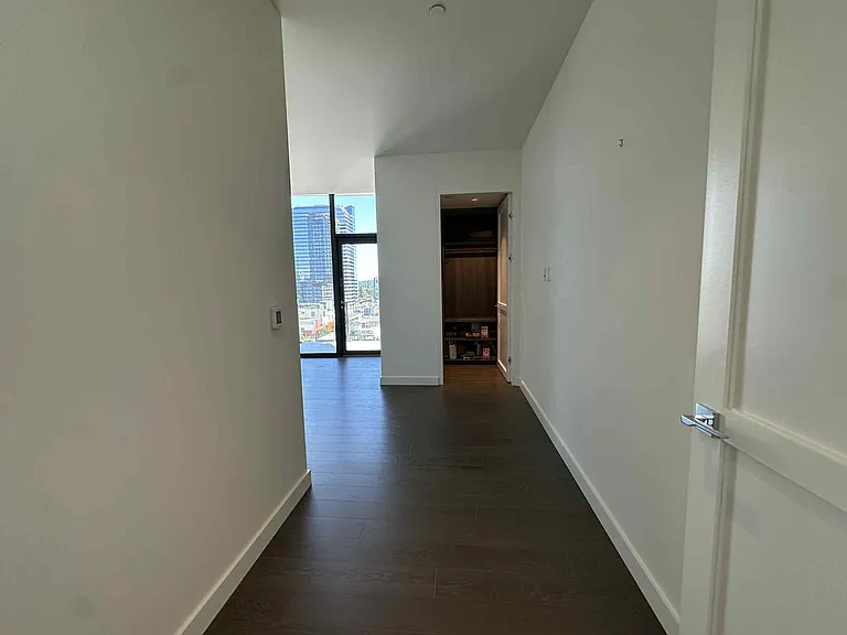 Primary bedroom entrance with two closets