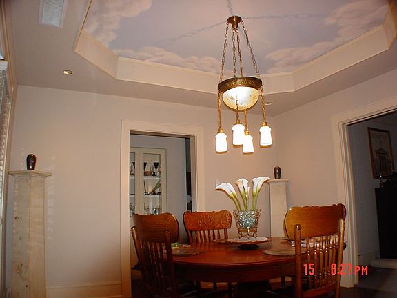 The dining room also has a sky ceiling and octagonal fur-down