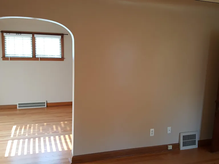 living room looking into dining. Front door to left
