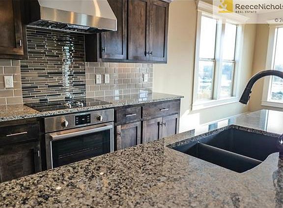 Kitchen includes: Granite counter tops, Kholer oil rubbed bronze kitchen faucet with integral sprayer, Bosch stainless steel appliances: range, dishwasher, microwave. Concealed cabinet door hinges, Soft-close drawers with designer pulls, and USB charging 