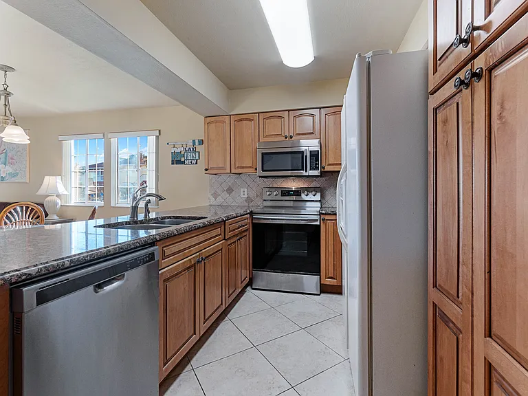 Enjoy the waterfront view while cooking from the well-equipped kitchen.